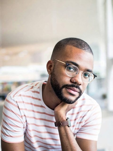 Buzz cut filter before and after on a Black man with an afro